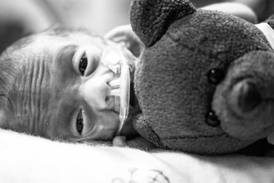 Preemie with a Beanie Baby bear