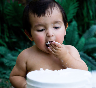 baby boy eating cake