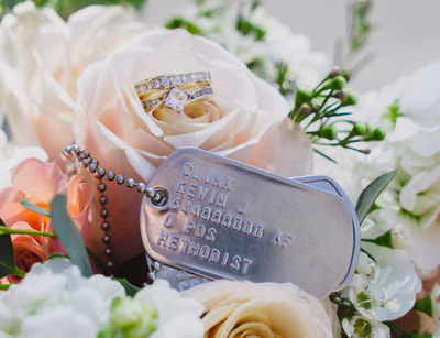 dog tags and rings in bouquet