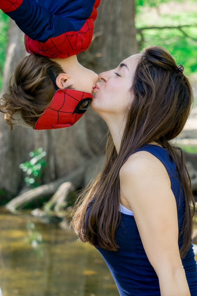 Ollie as Spiderman kissing his mom upside down